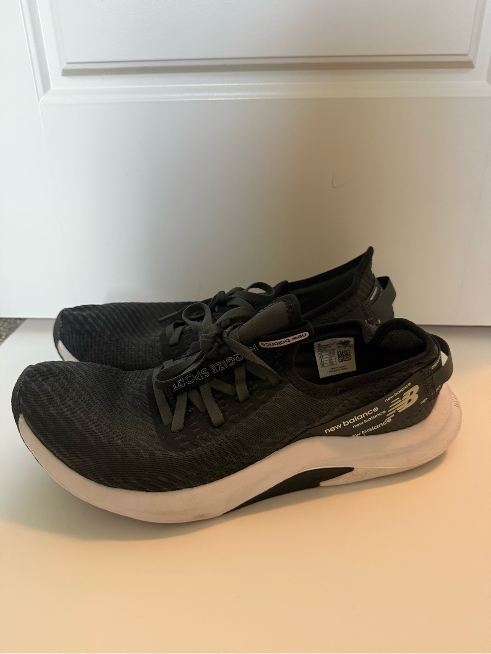New Balance Men’s Black and White Lightweight Knit Sneakers